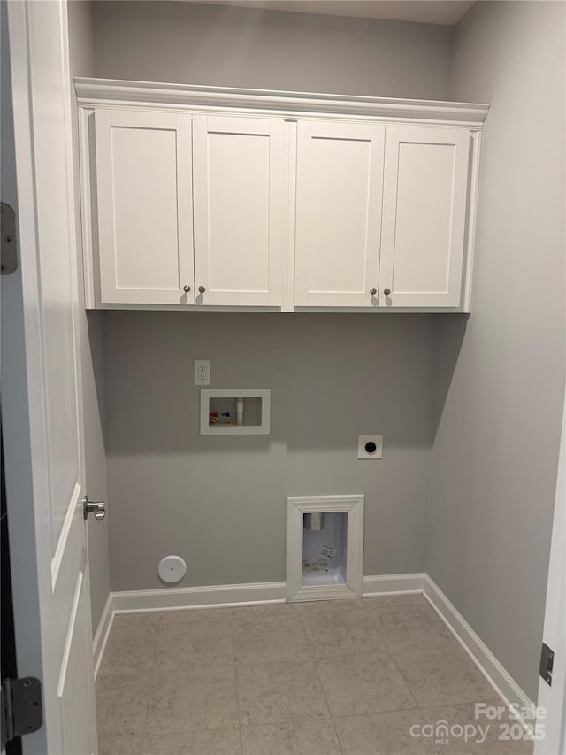 laundry area with cabinets, electric dryer hookup, gas dryer hookup, and hookup for a washing machine