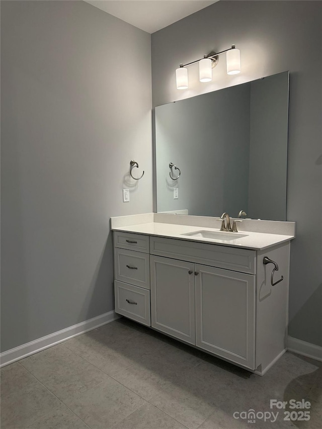 bathroom with vanity and tile patterned flooring