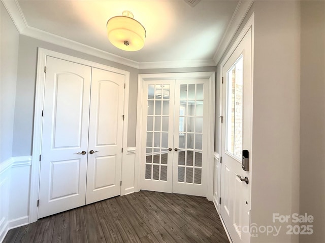 doorway to outside with dark wood-type flooring, a healthy amount of sunlight, french doors, and ornamental molding