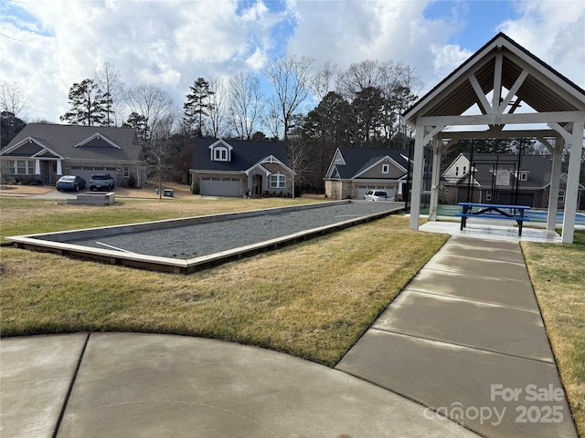 view of property's community with a gazebo, a yard, and a residential view