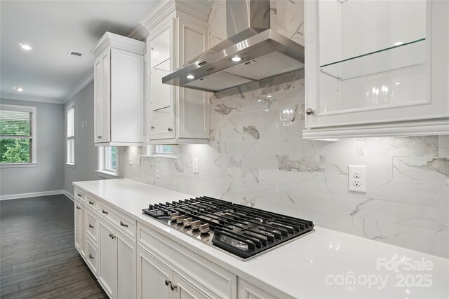 9657 Liberty Hill Dr, Mint Hill, NC 28227 - kitchen featuring wall chimney exhaust hood, stainless steel gas stovetop, baseboards, white cabinets, and tasteful backsplash