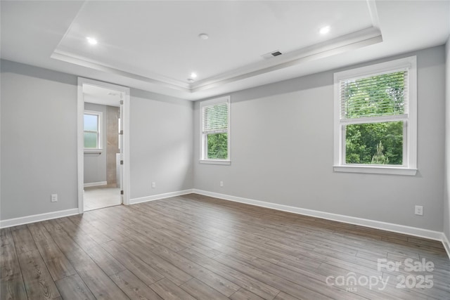9657 Liberty Hill Dr, Mint Hill, NC 28227 - empty room featuring a raised ceiling, baseboards, wood finished floors, and recessed lighting