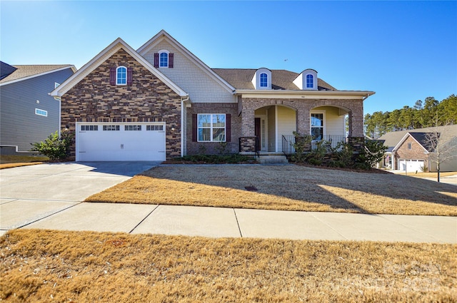 craftsman inspired home with covered porch and a garage