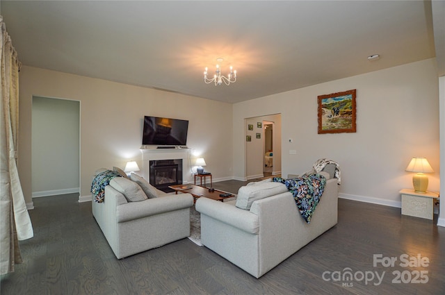 living room featuring dark hardwood / wood-style floors and a notable chandelier