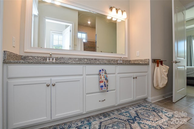 bathroom with vanity and tile patterned floors