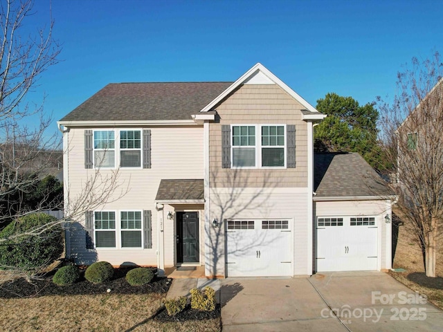 front facade with a garage