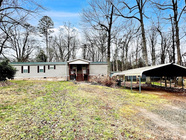 view of front facade with a carport and a front yard