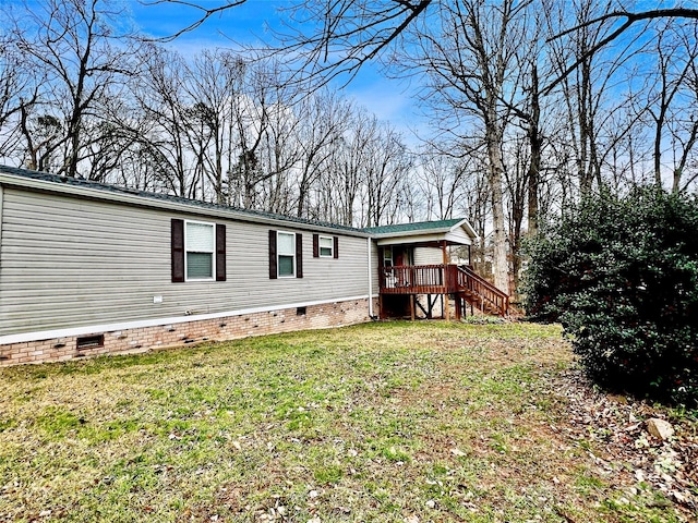 exterior space featuring a wooden deck and a yard