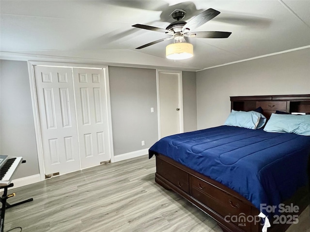 bedroom with ceiling fan and light wood-type flooring