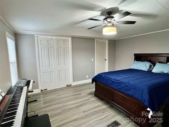 bedroom with ceiling fan and light hardwood / wood-style floors