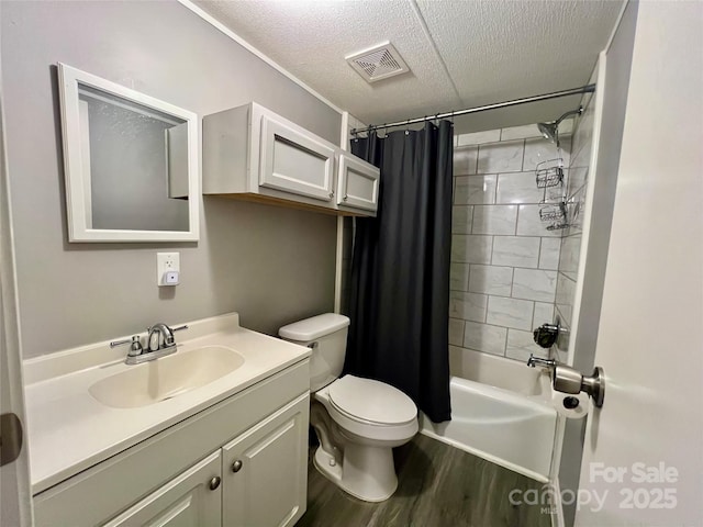 full bathroom with toilet, vanity, shower / bath combination with curtain, hardwood / wood-style flooring, and a textured ceiling