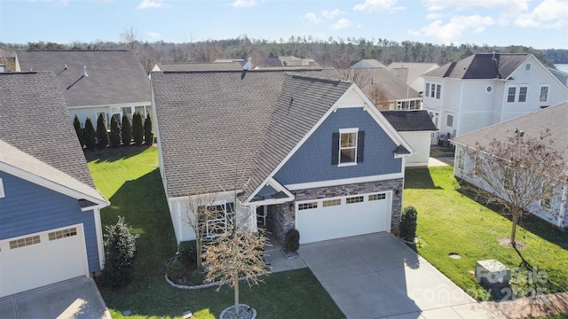 view of front of property with a front lawn and a garage