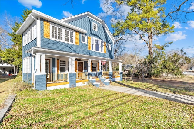 view of front facade featuring a front lawn and covered porch