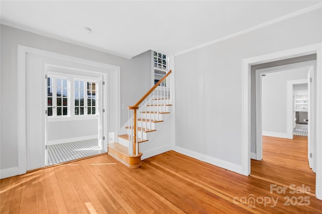 interior space with crown molding and hardwood / wood-style floors