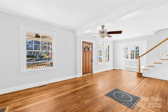 interior space with ceiling fan and hardwood / wood-style flooring