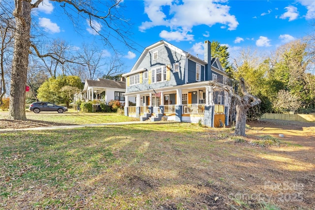 front of property featuring covered porch and a front lawn