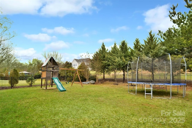 view of jungle gym with a trampoline and a lawn