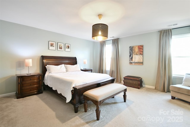 bedroom featuring light colored carpet