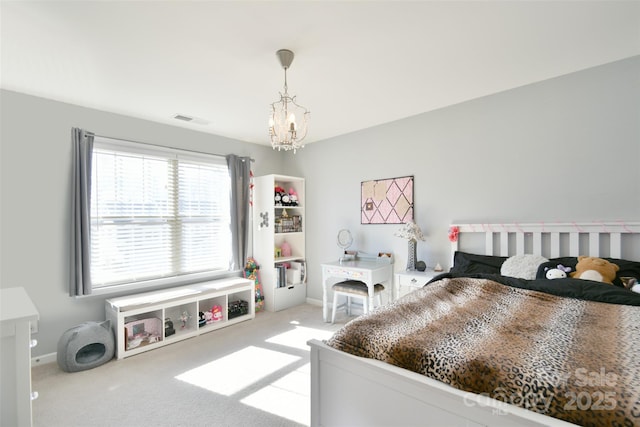 carpeted bedroom featuring a chandelier