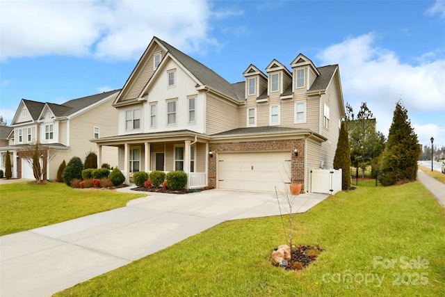 view of front of property with a garage, covered porch, and a front yard