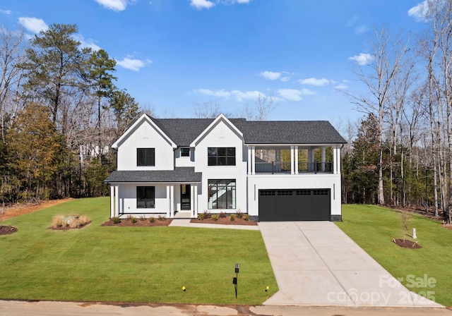 view of front of home featuring a garage and a front lawn