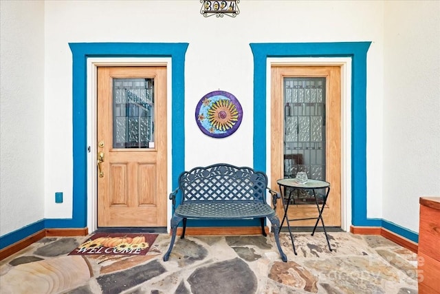 property entrance featuring stucco siding