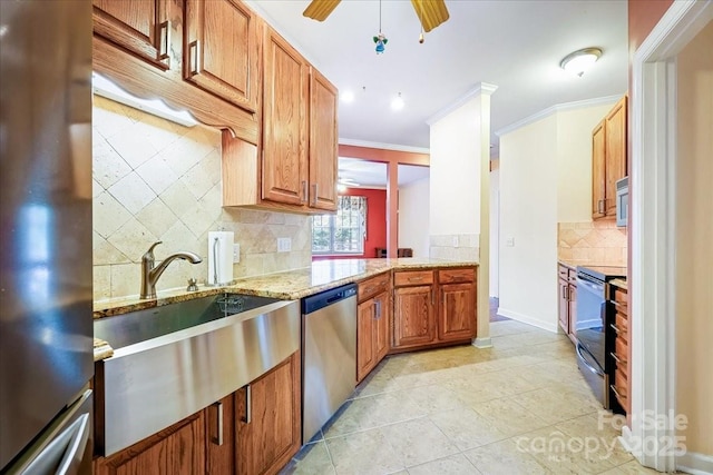 kitchen with light stone counters, decorative backsplash, light tile patterned flooring, stainless steel appliances, and ornamental molding