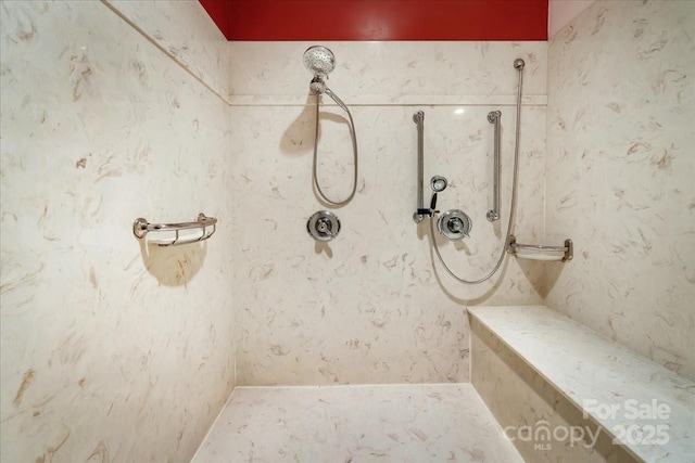 bathroom with a tile shower