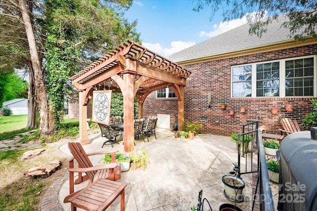 view of patio featuring outdoor dining area and a pergola