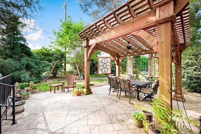 view of patio with a pergola and outdoor dining space