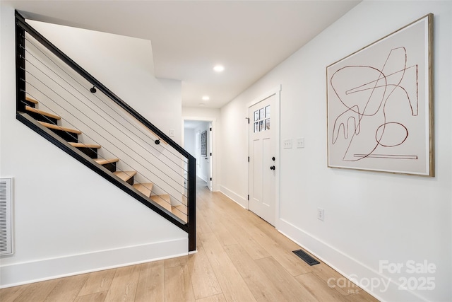 foyer with light wood-type flooring