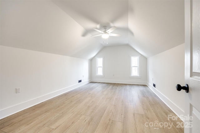 additional living space featuring ceiling fan, lofted ceiling, and light hardwood / wood-style floors