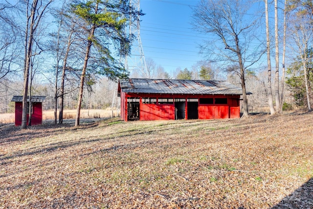 view of outdoor structure with a lawn