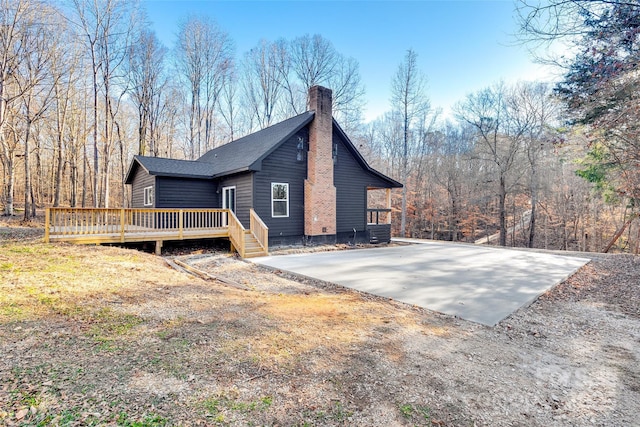 view of home's exterior featuring a wooden deck and central AC