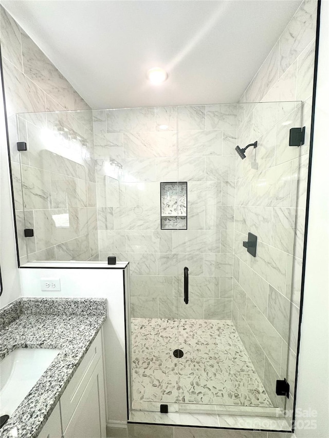 bathroom with vanity and walk in shower