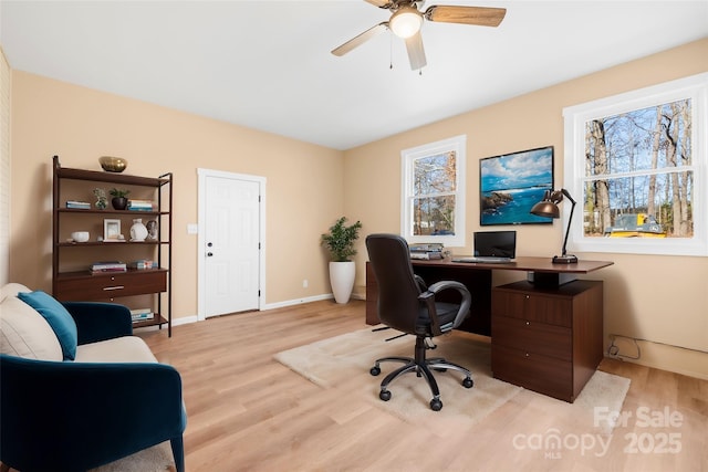 office featuring wood finished floors, baseboards, and ceiling fan