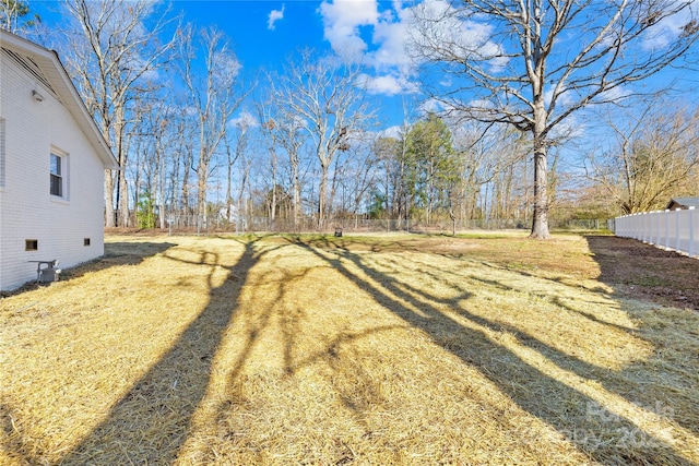 view of yard featuring fence