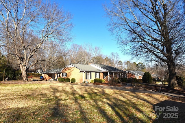 view of property exterior featuring a lawn