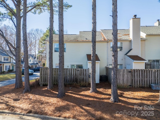 view of side of property featuring central AC unit