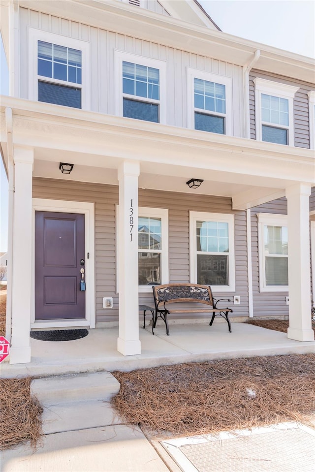 property entrance with covered porch