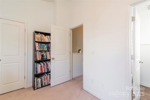 interior space featuring light colored carpet