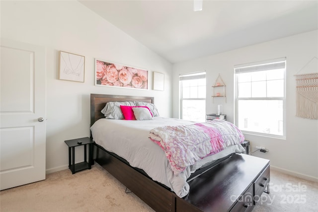 carpeted bedroom featuring vaulted ceiling