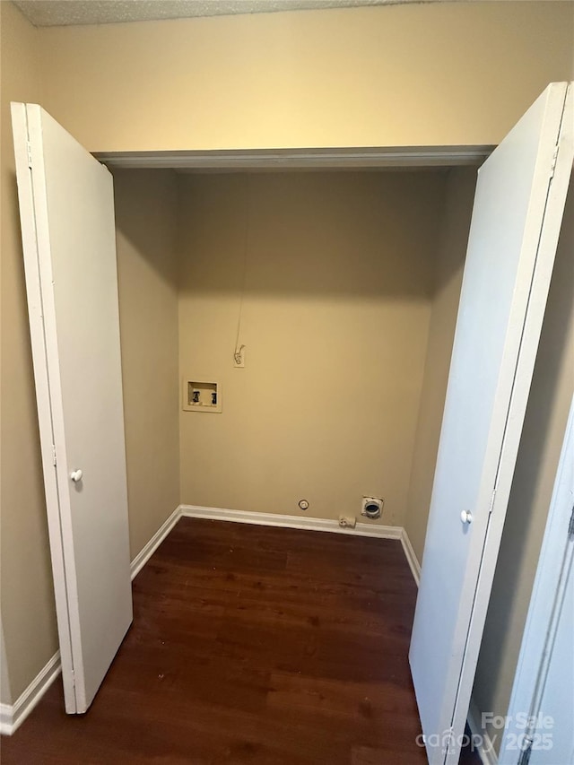 laundry room featuring dark wood-type flooring and hookup for a washing machine