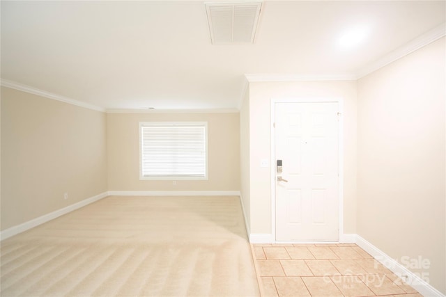 spare room with crown molding and light tile patterned flooring