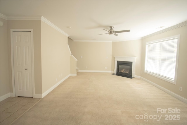 unfurnished living room with light carpet, ornamental molding, and ceiling fan