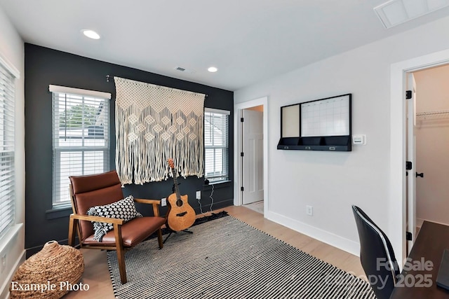 living area with light hardwood / wood-style flooring