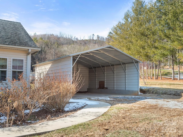 view of parking / parking lot with a carport