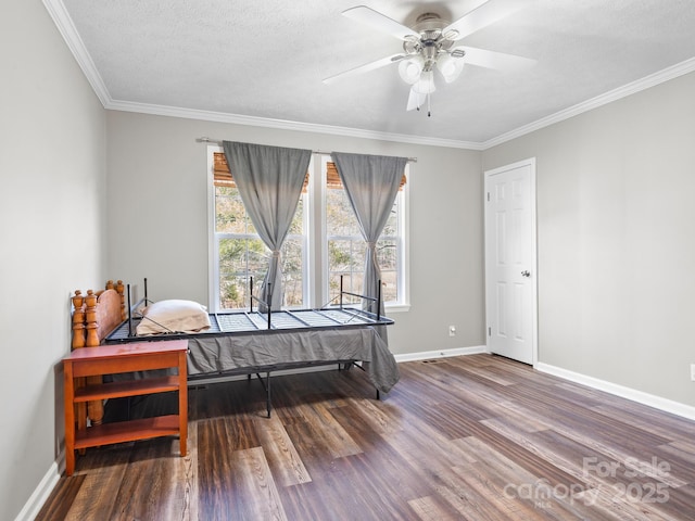 bedroom with ceiling fan, crown molding, a textured ceiling, and hardwood / wood-style flooring