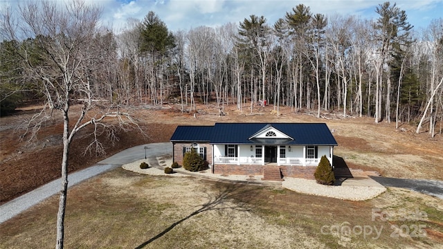 view of front of home with a front lawn and a porch