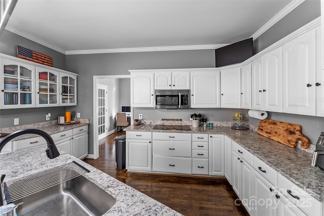 kitchen featuring white cabinetry, light stone countertops, sink, and dark hardwood / wood-style flooring